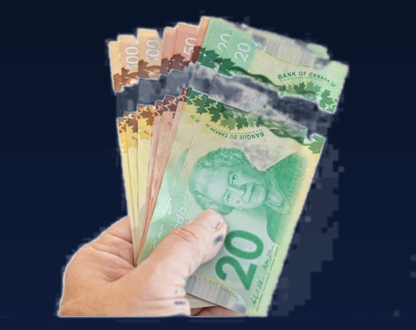Canadian polymer banknotes fanned in hand